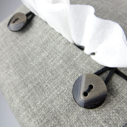 Close up view of square tissue box cover with buttons