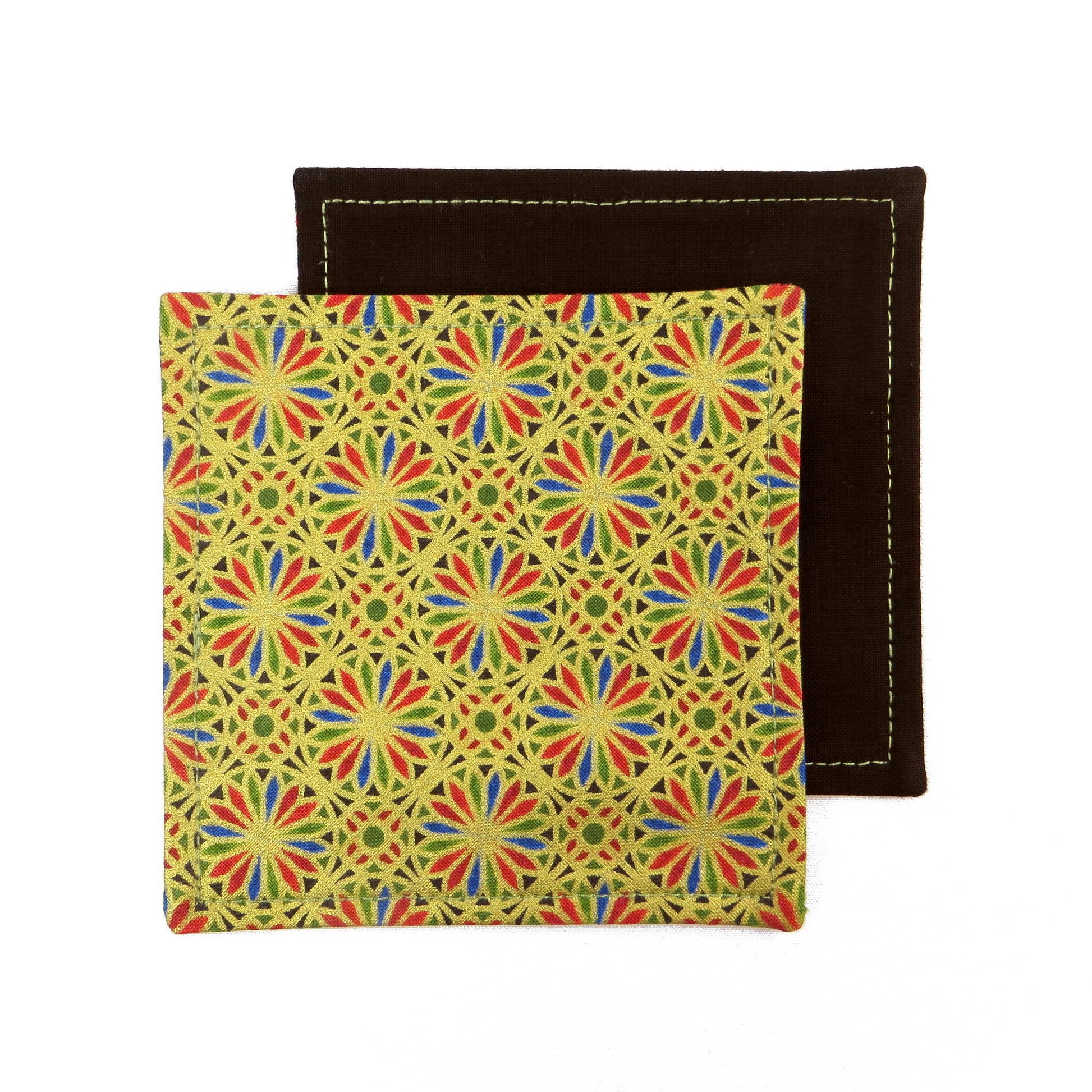 Square coasters with holiday themed blue, red, and green petals, with metallic gold accent
