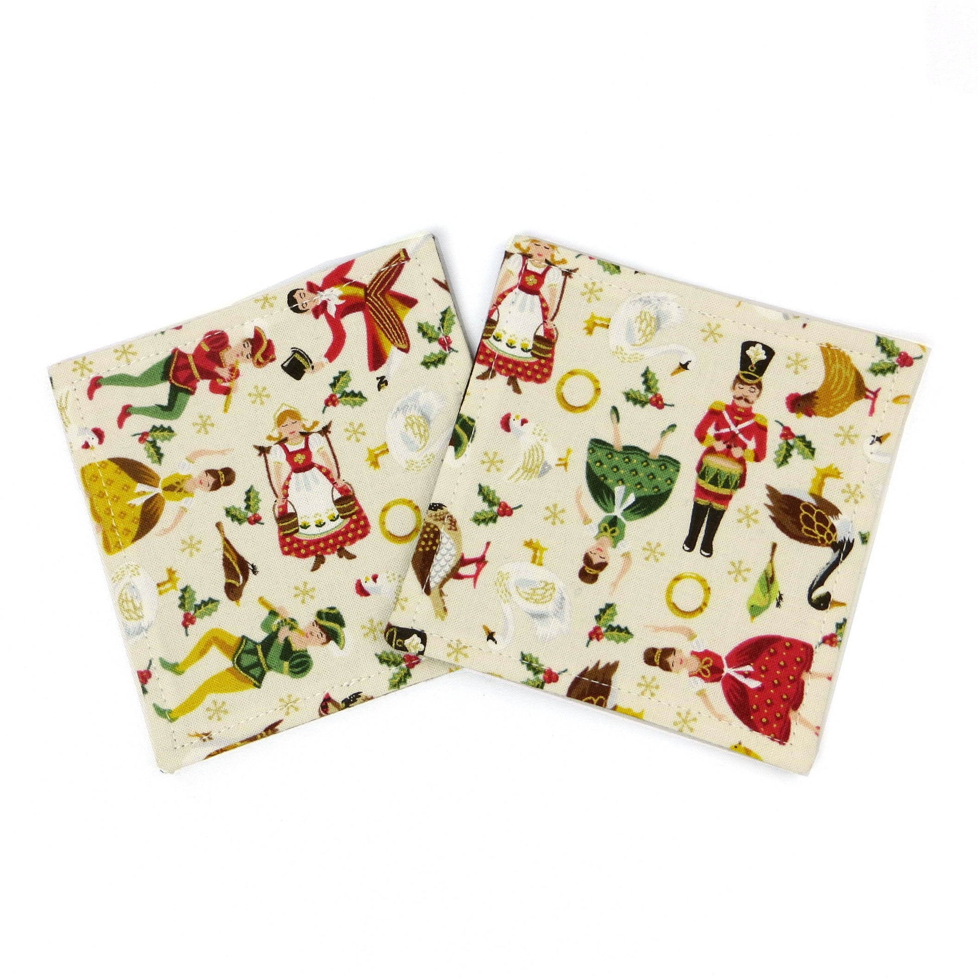 Square coasters with holiday themed multi colour icons of the 12 Days of Christmas on off-white background