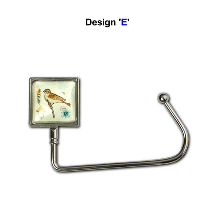 Handbag hook with a glass domed bird and branch image