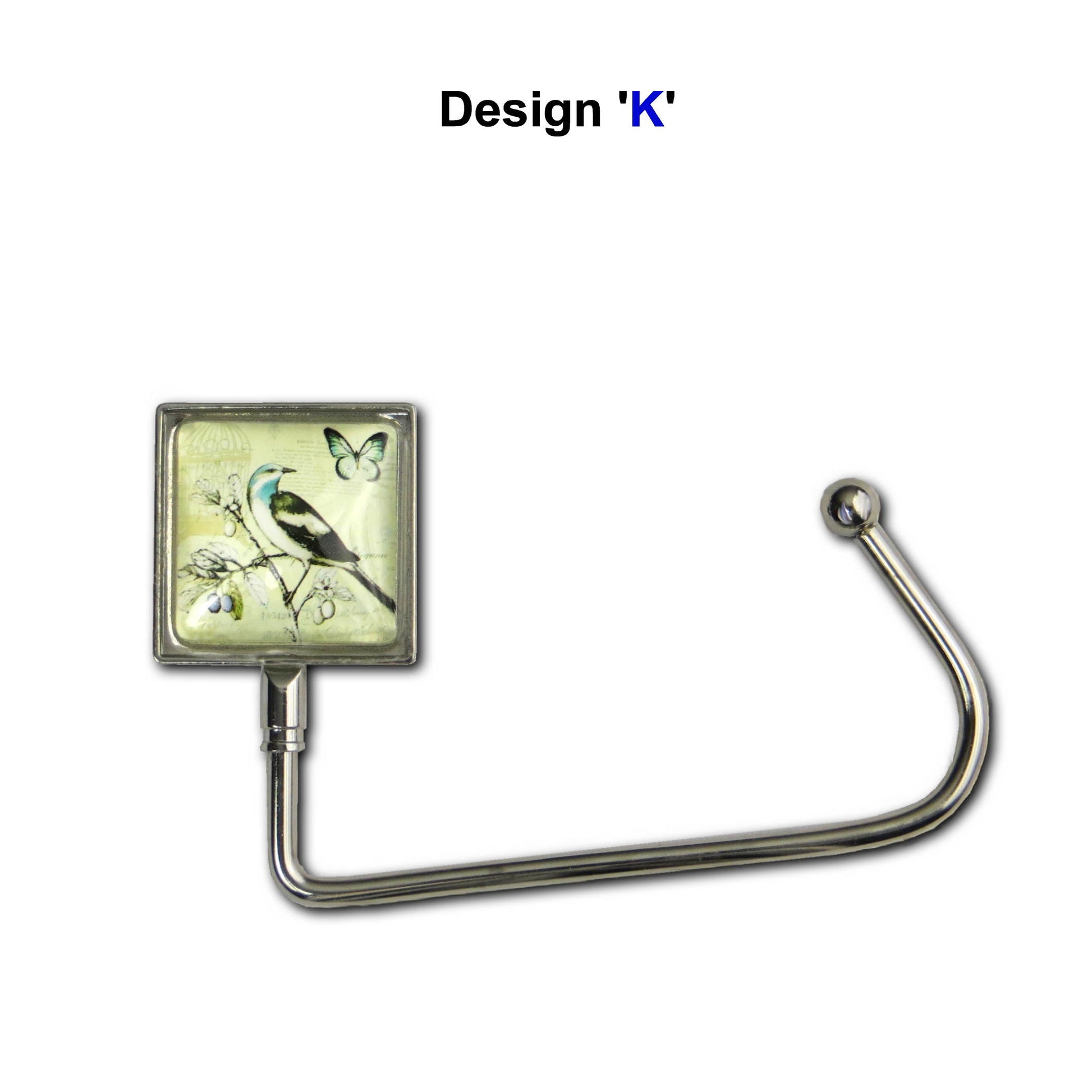 Handbag hook with a glass domed bird and butterfly image