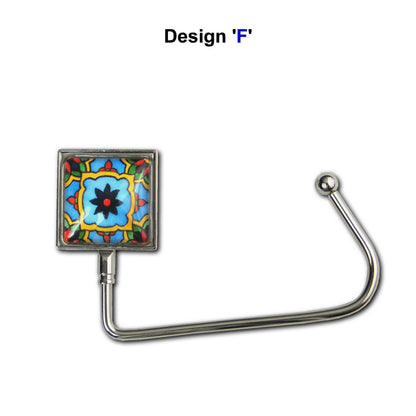 Handbag hook with a glass domed blue, yellow, and red tile image