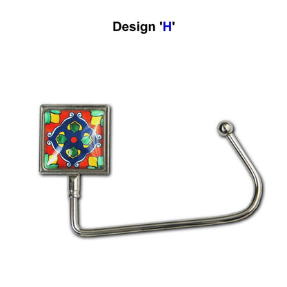 Handbag hook with a glass domed red, blue, and yellow tile image