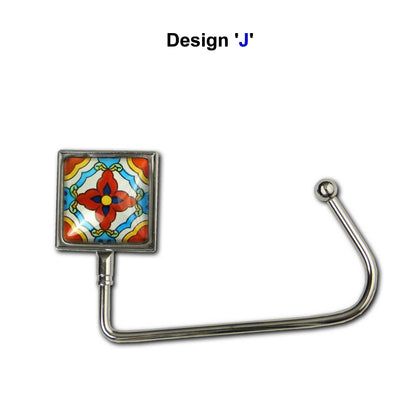 Handbag hook with a glass domed red, blue, and yellow tile image