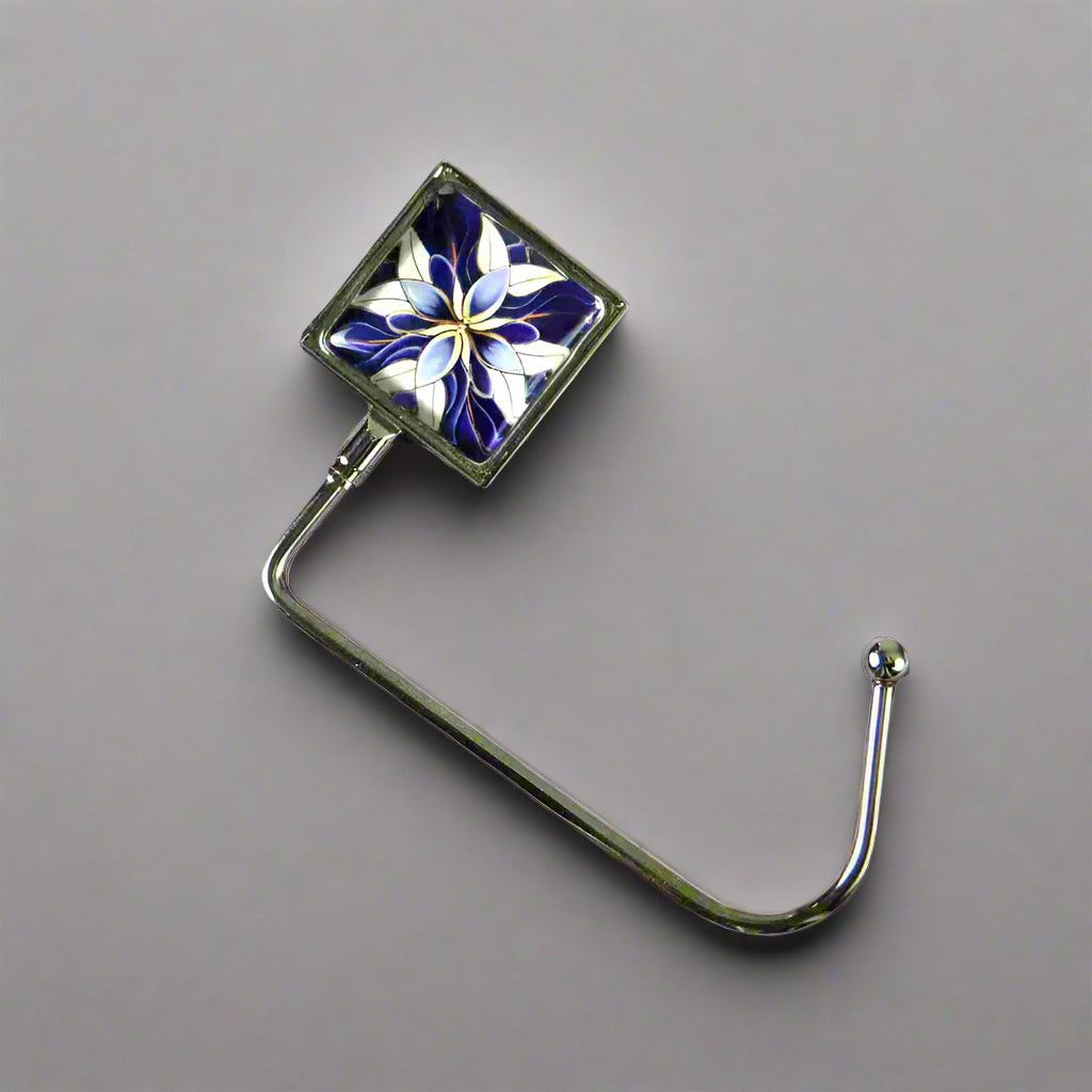 Handbag hook with glass domed image for hanging accessories on tables, ledges, and shelves