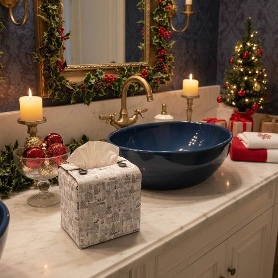 Tissue box cover with a black and white winter village scene displayed in a bathroom and living room
