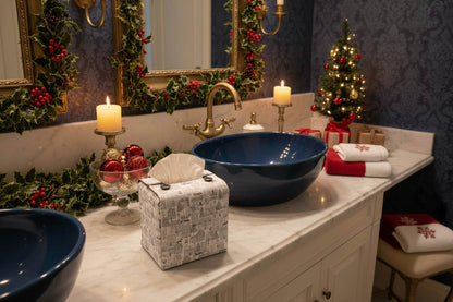 Tissue box cover with a black and white winter village scene displayed in a bathroom and living room