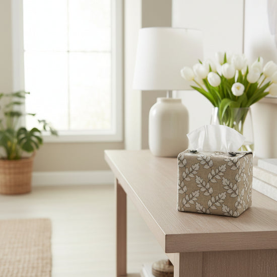 Handmade cotton cube tissue box cover with floral design displayed in a living room