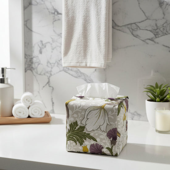 Handmade tissue box covers with a purple and white magnolia flower design displayed in a bathroom