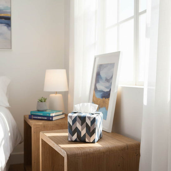 Handmade tissue box cover with a blue, white, and grey herringbone design displayed in a bedroom and kitchen
