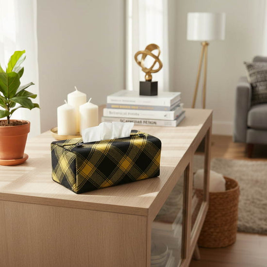 Handmade cotton rectangular tissue box cover with black and yellow plaid design displayed in a living room