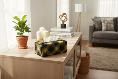 Handmade cotton rectangular tissue box cover with black and yellow plaid design displayed in a living room