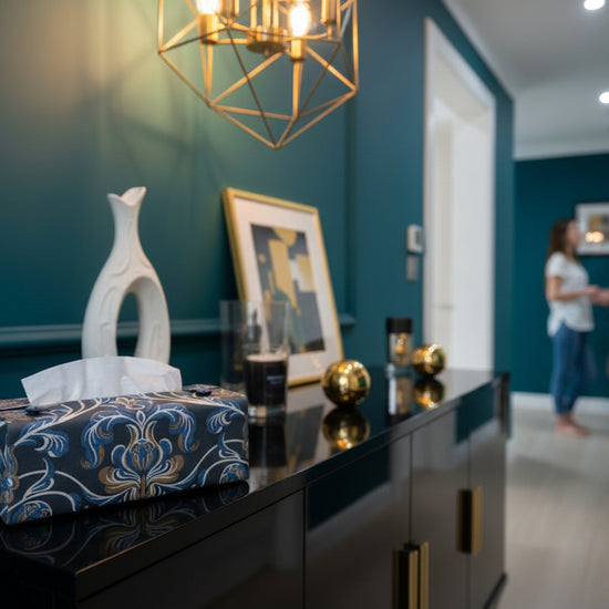Handmade tissue box covers with baroque style floral design on navy background displayed in a bedroom and hallway
