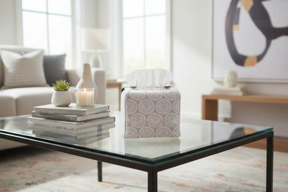Handmade tissue box cover with retro daisy design displayed in a living room