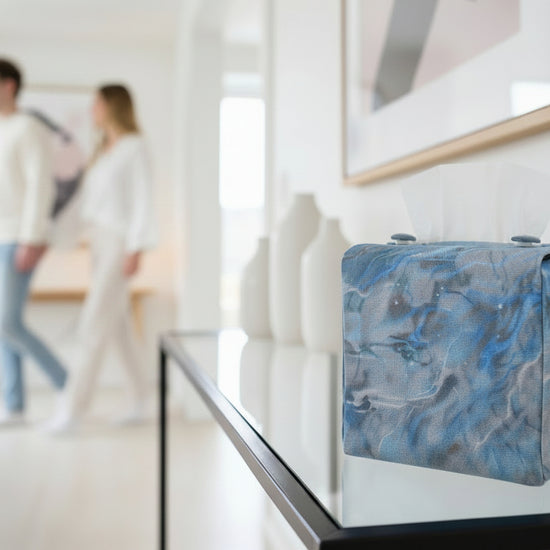 Handmade fabric tissue box covers with light blue abstract design displayed in a hallway and living room