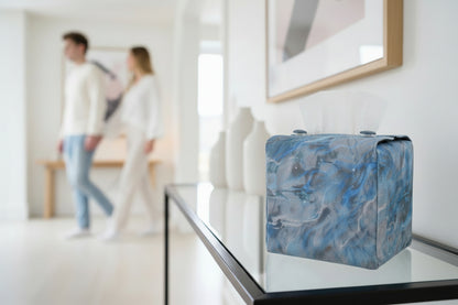 Handmade fabric tissue box covers with light blue abstract design displayed in a hallway and living room