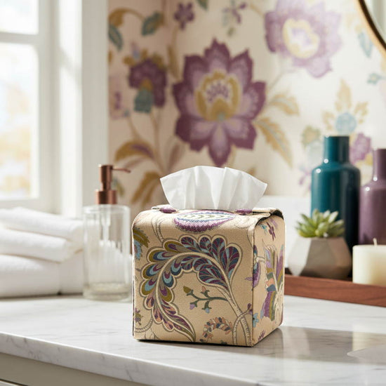 Handmade tissue box cover with floral design displayed in a bathroom