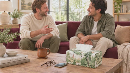 Handmade rectangular cotton tissue box cover with traditional country toile pattern in green on an off-white background, displayed in living room and bedroom.