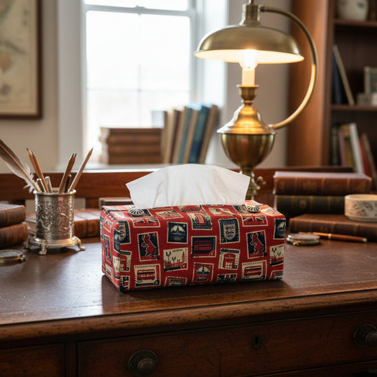 Tissue box cover with British stamps on red design displayed in a bedroom and kitchen