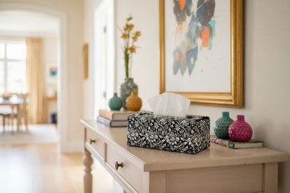 Tissue box cover with black and white floral design displayed in a bedroom and hallway