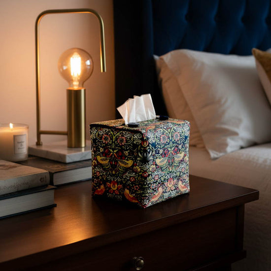 Tissue box cover with a birds and berries design displayed in a bedroom and living room