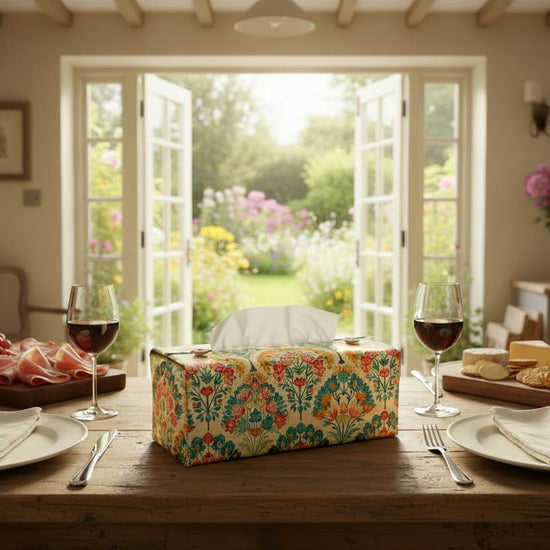 Tissue box cover with colourful floral design displayed on a window bench and kitchen dining table