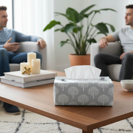 Tissue box cover with white mulberry trees design on blue background displayed in a kitchen and living room