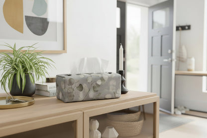 Tissue box cover with lunaria leaves design on grey background displayed in a bathroom and hallway