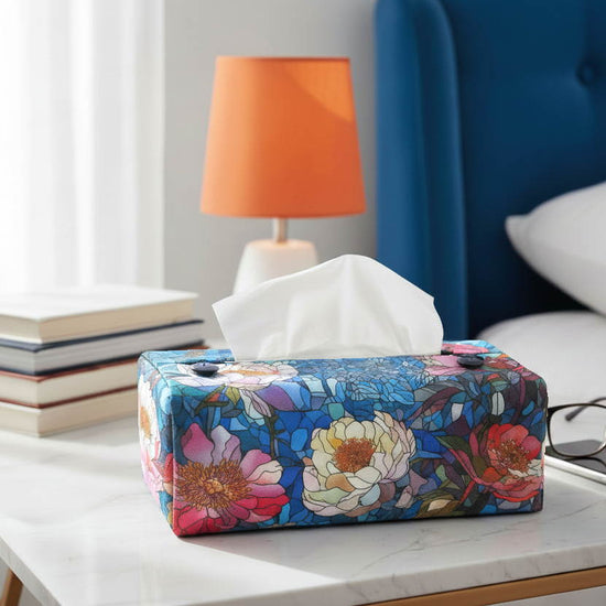 Tissue box cover with floral stained glass design on blue background displayed in a bathroom and bedroom