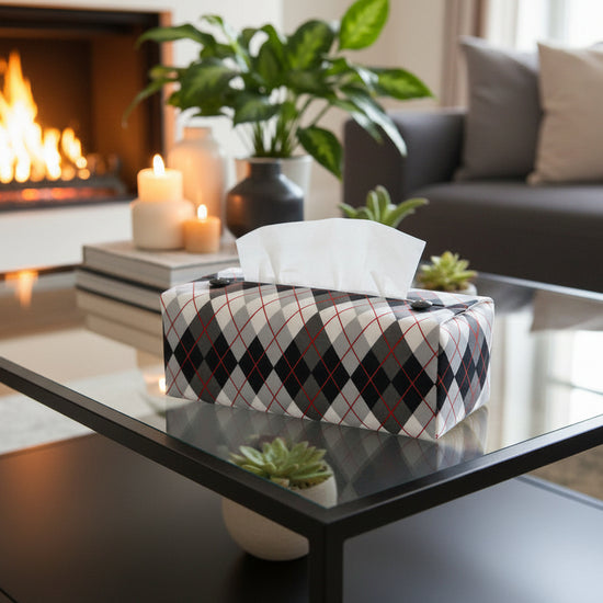 Tissue box cover with black and white Argyle pattern displayed in a home entrance and living room