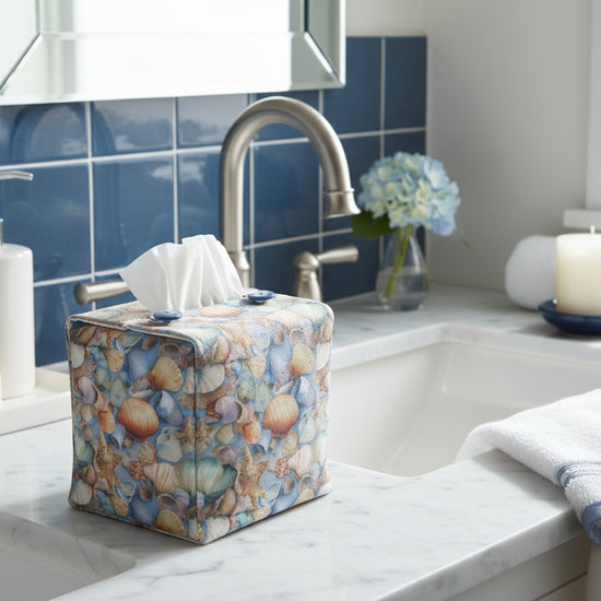 Tissue box cover with seashells pattern displayed in a bathroom and living room