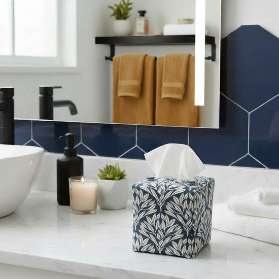 Blue tissue box cover with leaf design displayed in a bathroom and living room