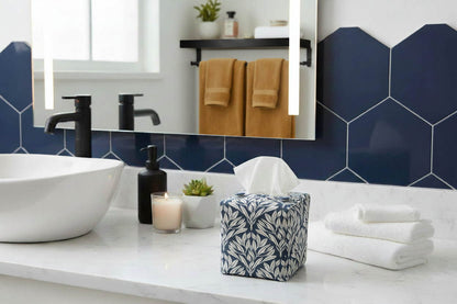Blue tissue box cover with leaf design displayed in a bathroom and living room
