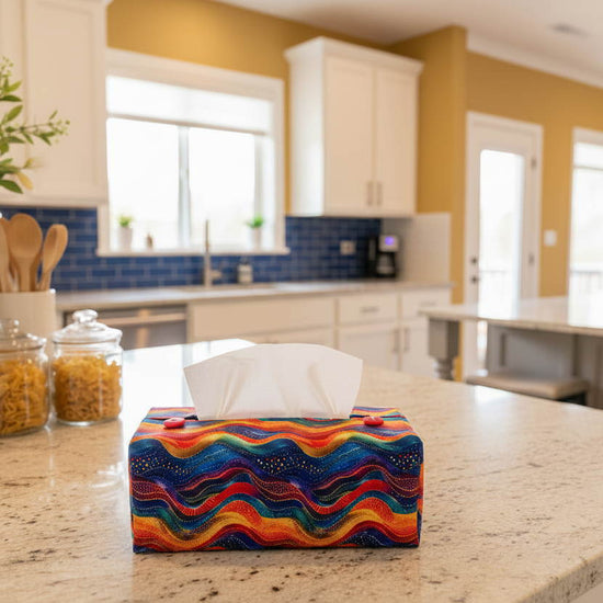 Tissue box cover with a colourful wave design displayed in a bedroom and kitchen