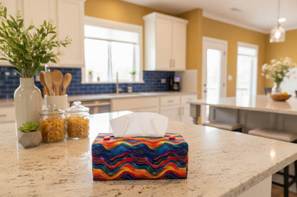 Tissue box cover with a colourful wave design displayed in a bedroom and kitchen