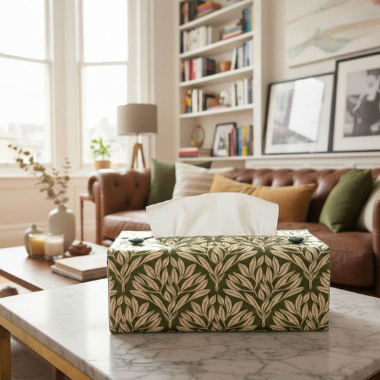 Sage green tissue box cover with leaf design displayed in a bedroom and living room