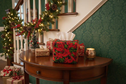 Tissue box cover with a poinsettia design displayed in a hallway