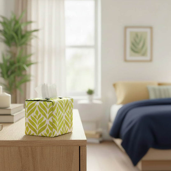 Handmade tissue box covers with yellow watercolour leaf design displayed in a bedroom and conservatory