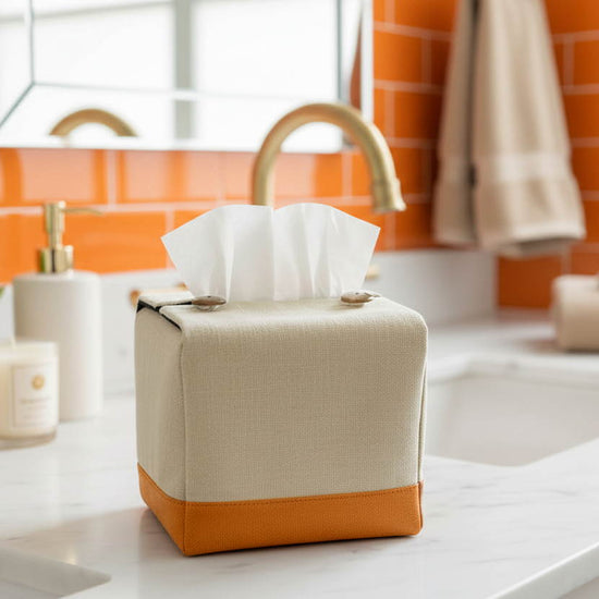 Handmade tissue box covers with a two tone beige and orange design displayed in a bedroom and kitchen