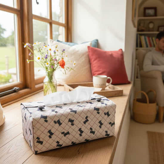 Handmade tissue box cover with scottie dog design displayed in a living room