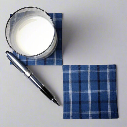 Square coasters with black, white, and blue plaid pattern